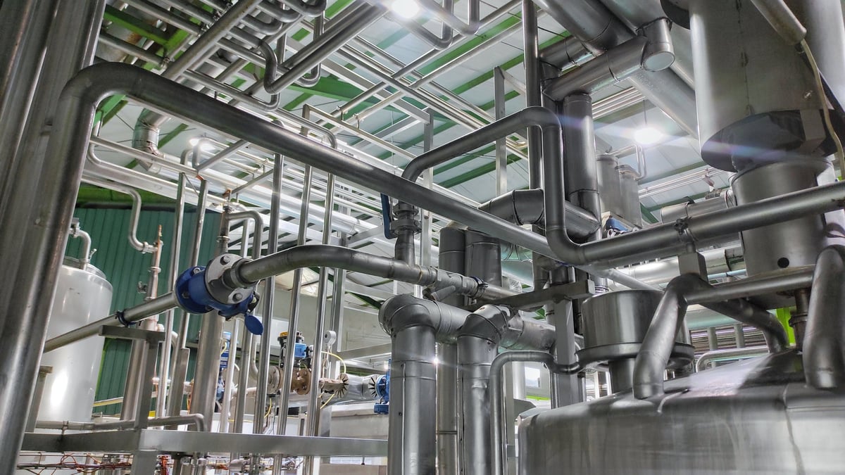 Stainless steel pipe system flowing water in a production facility
